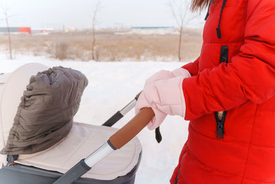 Rear view of woman standing in winter