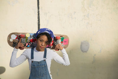 A young woman with a skateboard