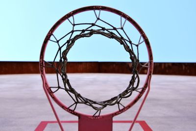 Low angle view of basketball hoop against clear sky