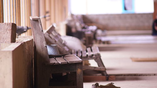 Empty wooden bench in passage