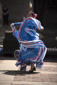 Midsection of woman dancing on stage