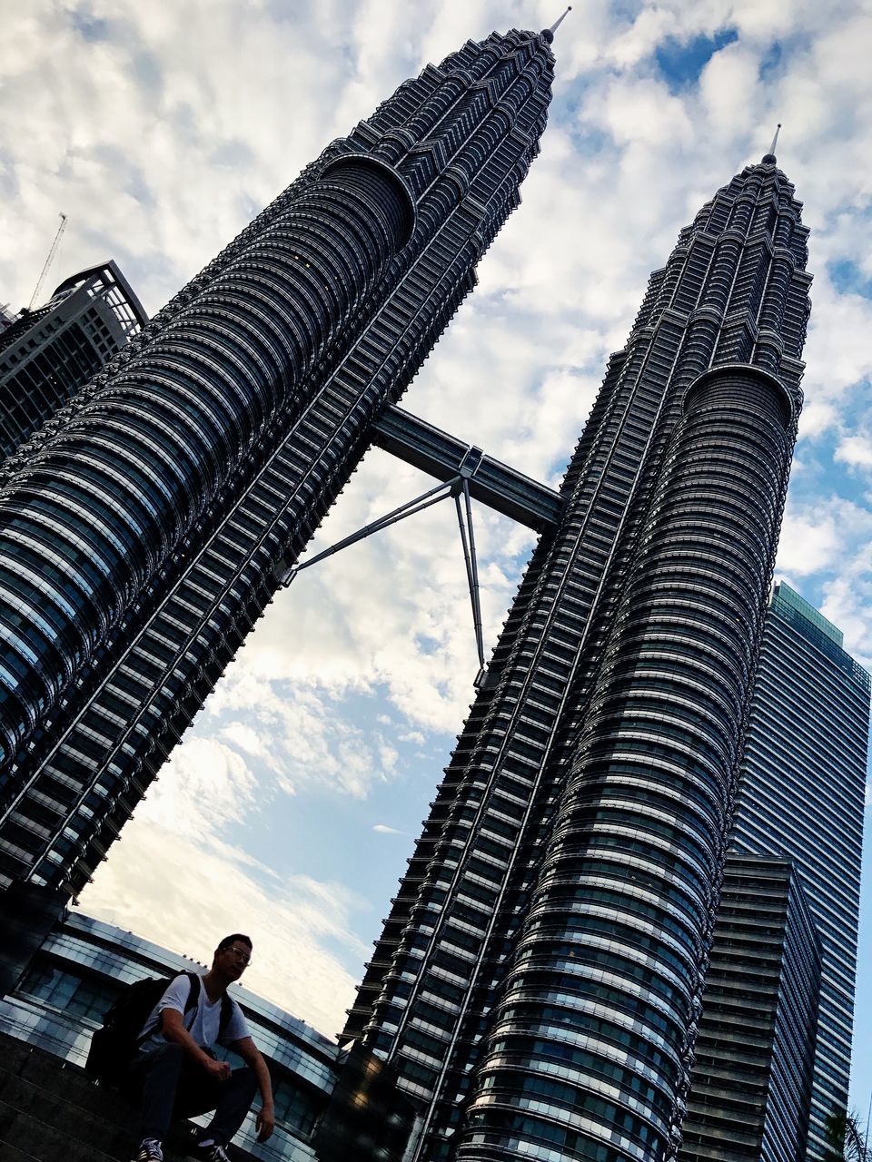 sky, architecture, low angle view, travel destinations, cloud - sky, city, outdoors, day, skyscraper, modern, cultures, no people