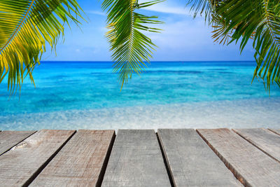 Scenic view of swimming pool by sea against sky