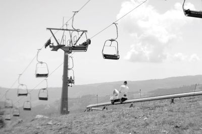 Overhead cable car against sky
