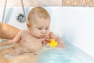 Cute baby girl in bathtub