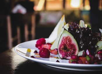 Close-up of strawberries in plate on table