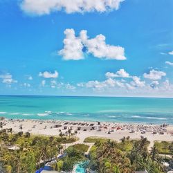 Scenic view of beach against blue sky