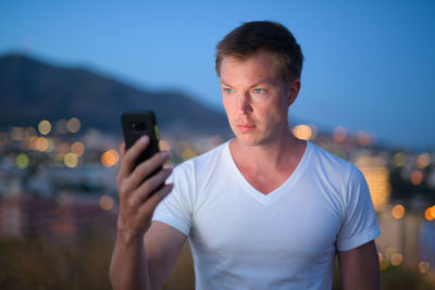 Young man using mobile phone