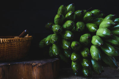 Close-up of green bananas on table