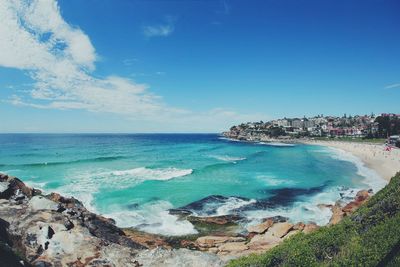 Panoramic view of sea against blue sky