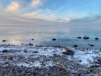 Scenic view of sea against sky during sunset