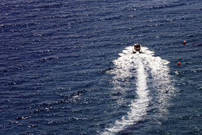 High angle view of man surfing in sea