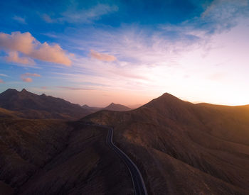 Scenic view of mountains against sky during sunset