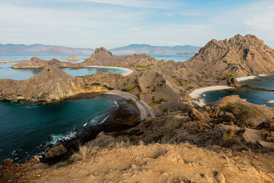 Panoramic view of sea and mountains against sky