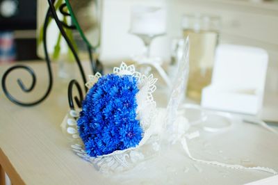 Close-up of blue flower on table