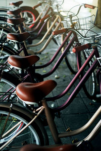 Close-up of bicycle parked in row