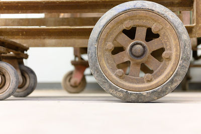 Close-up of metal wheel against blurred background