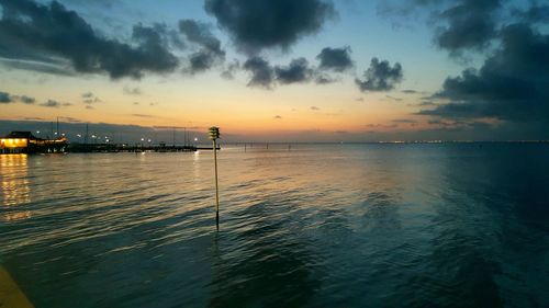 Scenic view of sea against cloudy sky