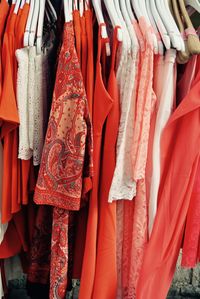 Close-up of clothes hanging on coathanger in store