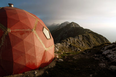 Red refugee on the mountain ridge. piatra craiului mountains, romania