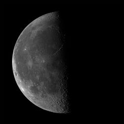 Low angle view of moon against clear sky at night