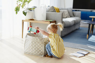 Girl playing with toys on floor