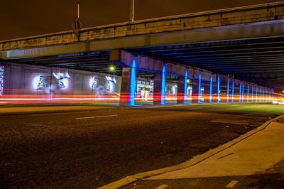 Light trails on road in city at night