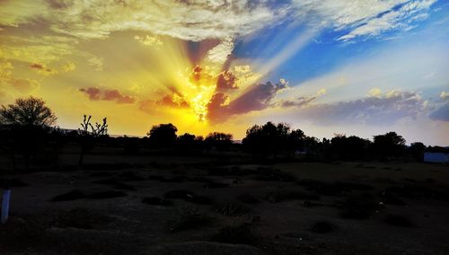 Scenic view of landscape against sky at sunset