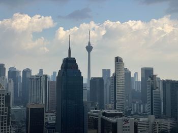 Skyscrapers in city against sky