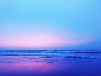 Scenic view of beach against sky during sunset