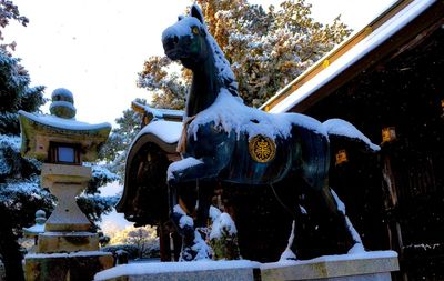 Statue of horse in winter