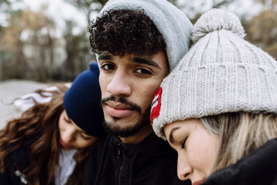 Portrait of handsome young man in snow