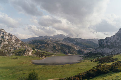 Scenic view of lake and mountains against sky