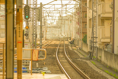 Train on railroad tracks in city