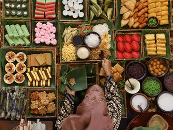 Directly above shot of woman hand holding food