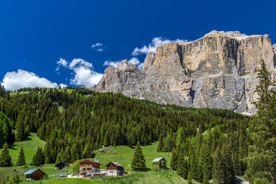 Scenic view of mountains against blue sky