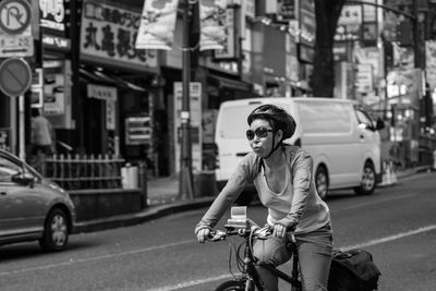 Woman standing on city street