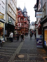 People walking on street in city