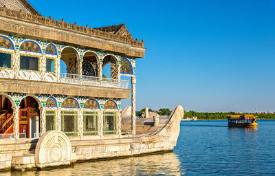 Low angle view of historic building against clear blue sky