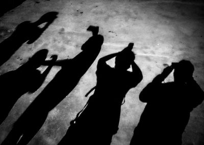 Shadow of people on street