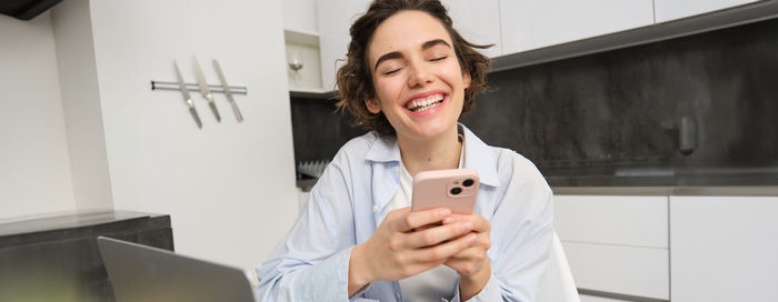 Young woman using mobile phone