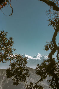 Scenic view of snowcapped mountains against clear sky