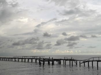 Pier over sea against sky