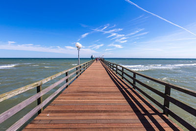 Pier over sea against sky