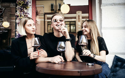 Group of people drinking glass on table