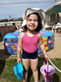 Portrait of cute girl standing in playground