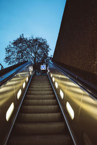 Low angle view of illuminated bridge against sky at night