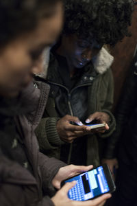 Young women checking their smart phones