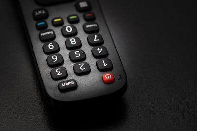 Close-up of remote control on table