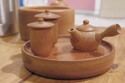 Wooden tea set on table at home